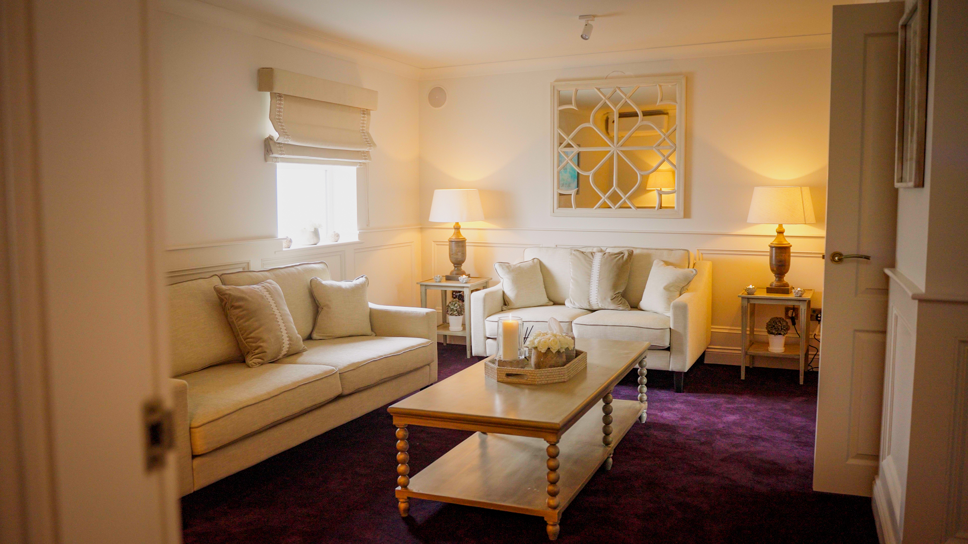 A spacious repose room with seating and soft lighting
