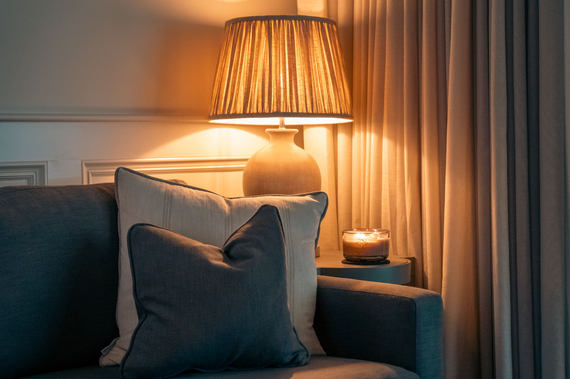 A close view of soft lamp light and comfortable seating