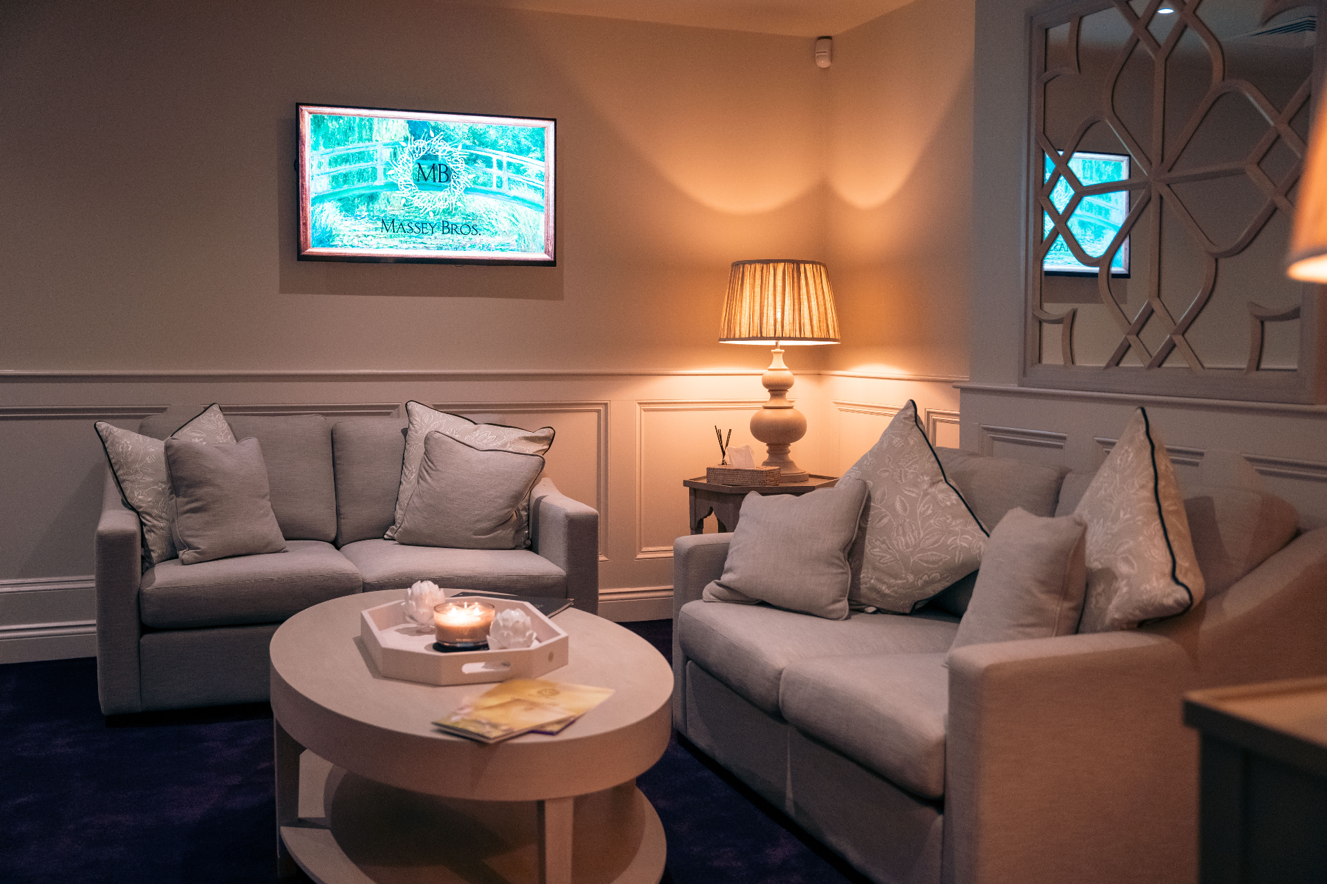 A welcoming family lounge with soft lighting and comfortable seating